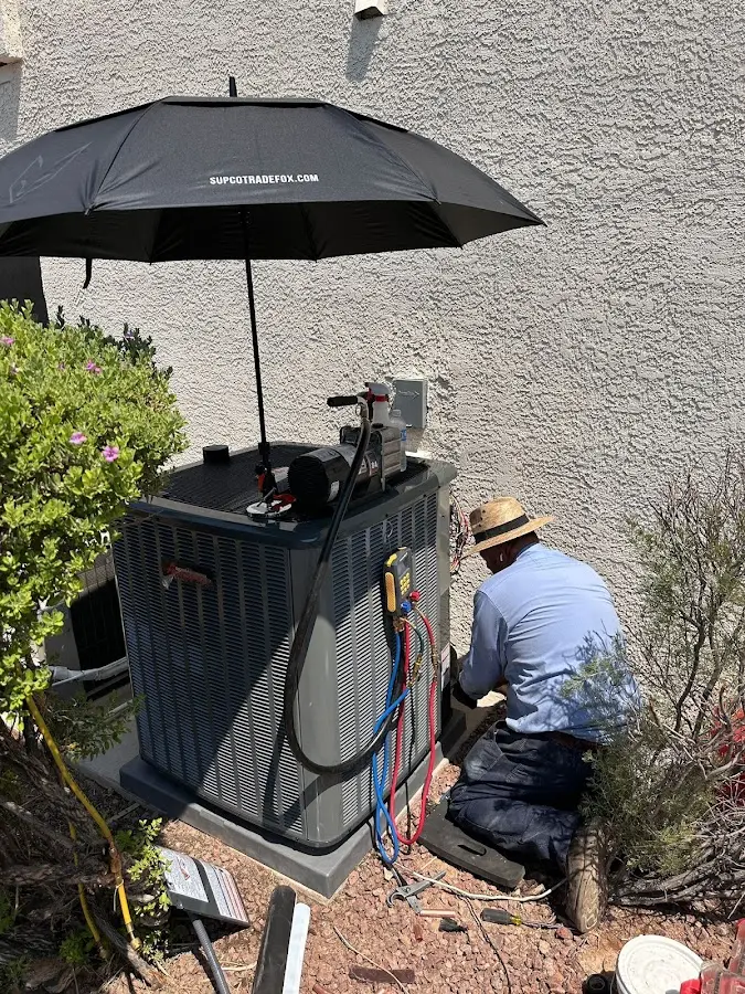 HVAC technician performing outdoor AC maintenance in Southlake